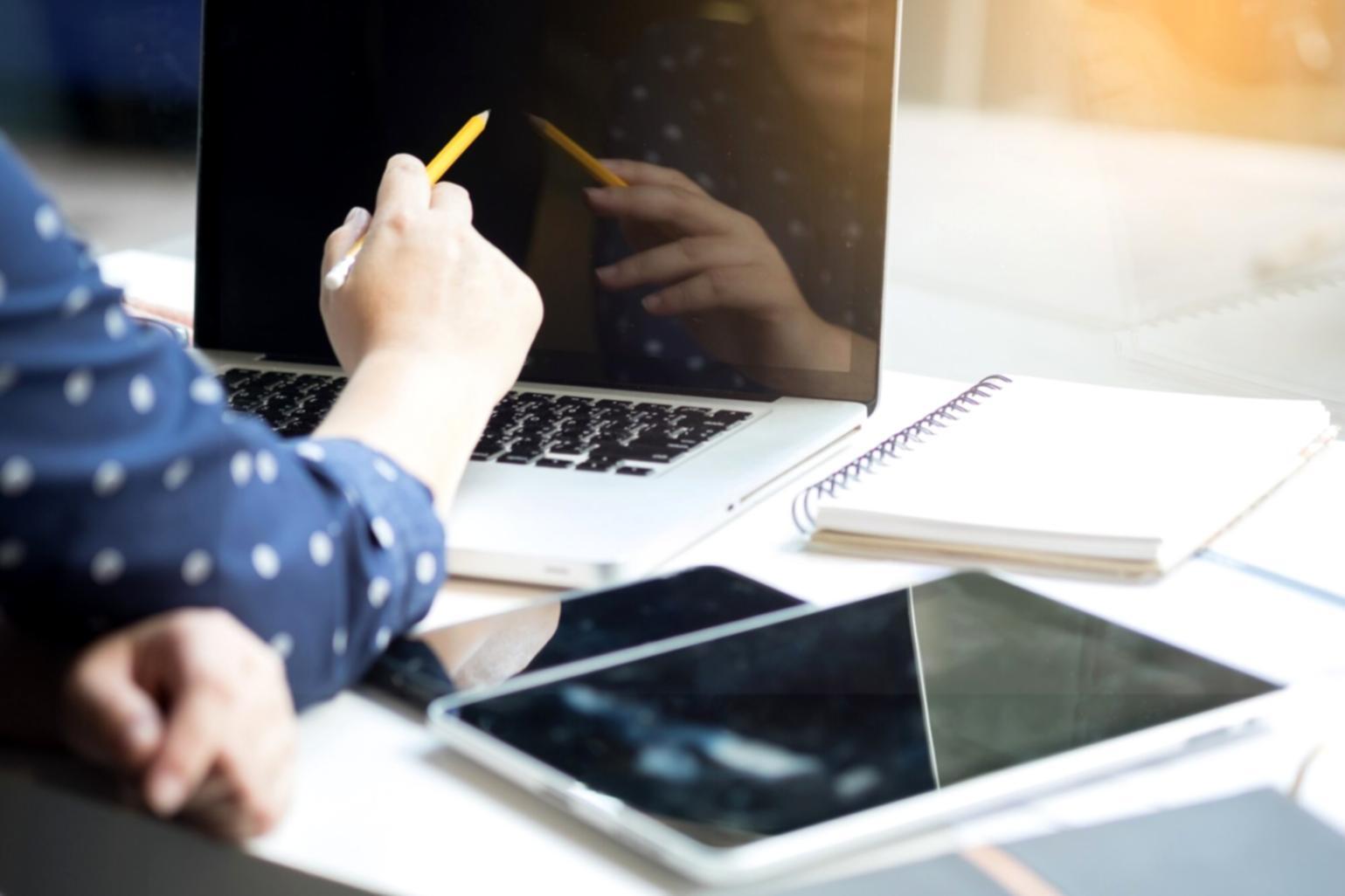 Financial planning workspace with budget documents and calculator